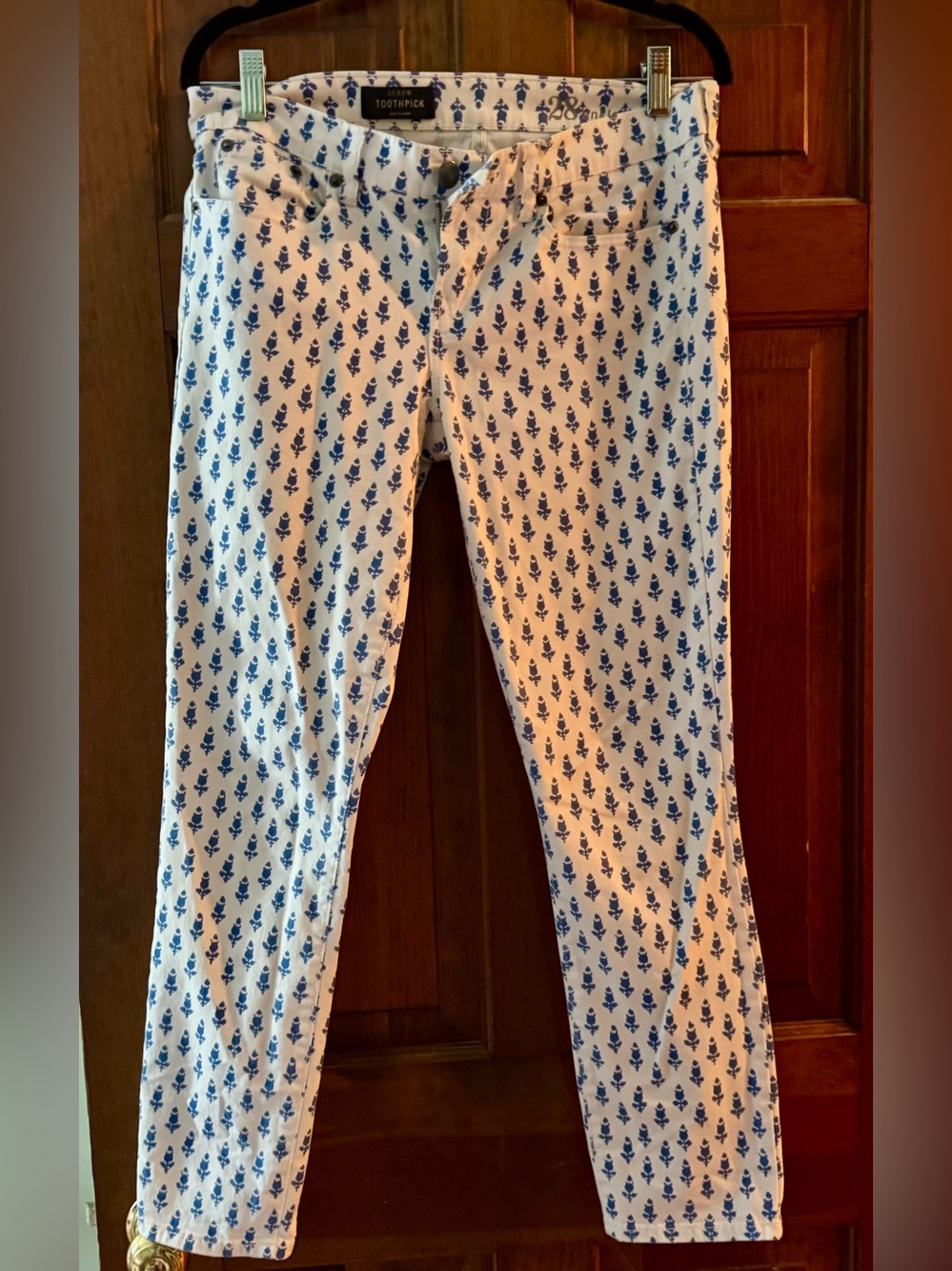 Blue and white print J Crew toothpick jeans.